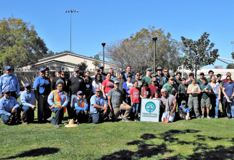 Group with TreeCity USA sign