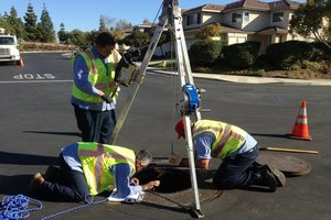 Crew investigating open manhole